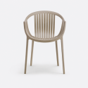 Chaise design ajourée avec accoudoirs pour extérieur